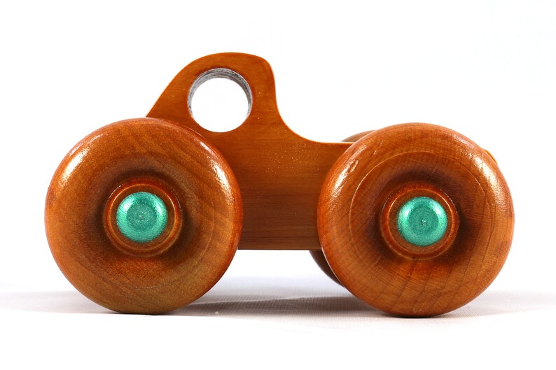 Wood Toy Monster Pickup Truck handmade in the USA from select hardwood finished with amber shellac with metallic emerald green trim. From my Play Pal Collection.