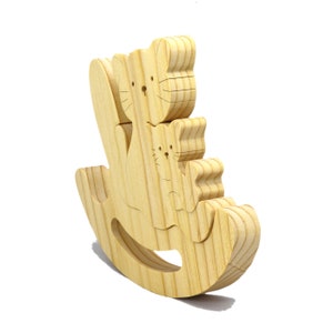Handmade Wood Puzzle featuring Moma Cat and Baby Kitten in a Rocker, a simple three-part design crafted with traditional woodworking tools. Smoothly sanded and finished with a blend of mineral oil and beeswax for a lustrous touch.