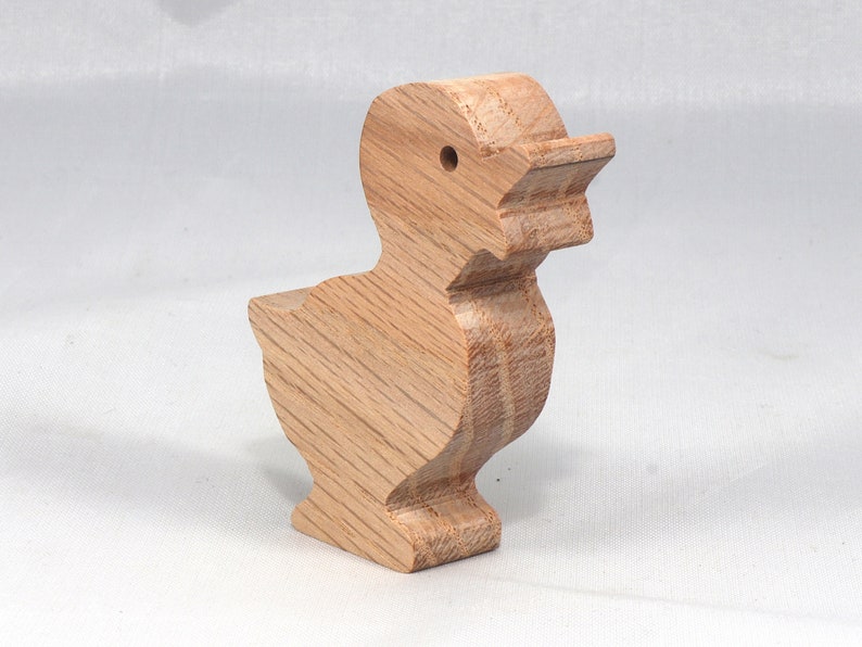 Wooden duck cutout, handmade, unfinished, and unpainted, from the Itty Bitty Animal Collection. Natural wood, freestanding, stackable, and paintable. Suitable for crafts or toys, American-made