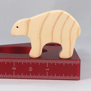 This is an unfinished wooden bear cutout from solid wood using traditional woodworking techniques. Sanded smooth and ready to paint, stain, or customize. Freestanding design for small hands, toddlers, young children, crafters, collectors, and display. I take custom orders for any animal, quantity, and mix — including large ornament orders. Mix and match, request a different size, or send a drawing or pattern. Handmade by Odin's Toy Factory in Tallahassee, Florida, USA.