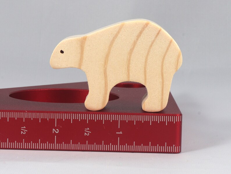 This is an unfinished wooden bear cutout from solid wood using traditional woodworking techniques. Sanded smooth and ready to paint, stain, or customize. Freestanding design for small hands, toddlers, young children, crafters, collectors, and display. I take custom orders for any animal, quantity, and mix — including large ornament orders. Mix and match, request a different size, or send a drawing or pattern. Handmade by Odin's Toy Factory in Tallahassee, Florida, USA.