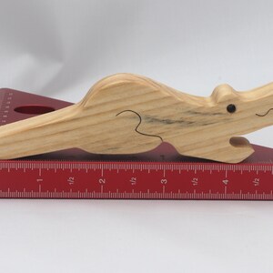 Handmade Wood Alligator Family Stacking Puzzle Mom and five baby (hatchling) alligators. This freestanding puzzle is hand-finished with a custom blend of mineral oil and waxes for a beautiful, smooth, and durable finish.