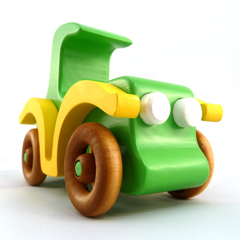 Handmade wooden toy car, vintage-style Model T sedan, painted bright green and yellow with spoked wheels, finished in amber shellac.  Handcrafted in Tallahassee, Florida, USA by Odin's Toy Factory.