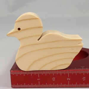 Handcrafted 2 inchwooden toy duck cutout made from 3/4-inch thick wood.