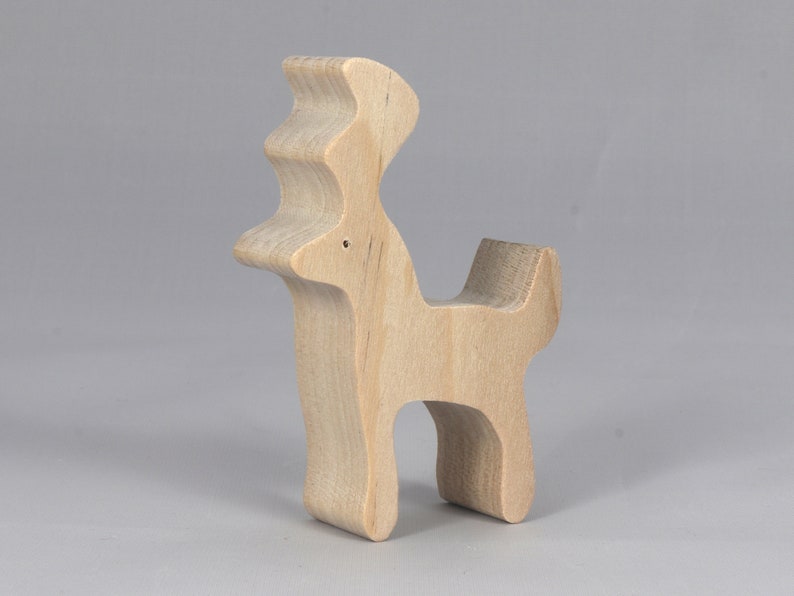 Handmade unfinished wooden deer toy figurine, part of the Itty Bitty Animal Collection, shown in natural light wood with visible grain, standing on a white background.