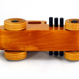 Handmade Wood Toy Car Hot Rod Based On The 1927 T-Coupe. It Has Been Hand-Finished With Multiple Coats Of Amber Shellac And Trimmed With Black Acrylic Paint.