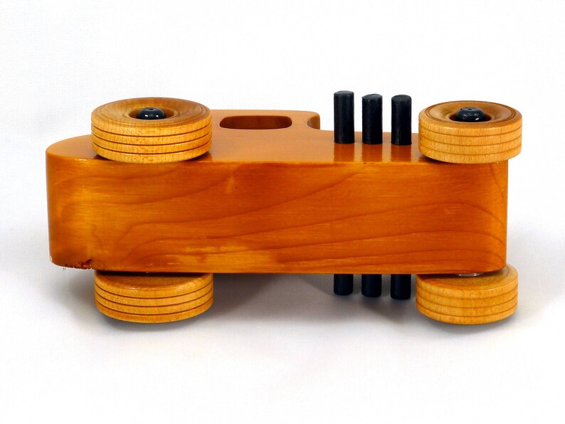 Handmade Wood Toy Car Hot Rod Based On The 1927 T-Coupe. It Has Been Hand-Finished With Multiple Coats Of Amber Shellac And Trimmed With Black Acrylic Paint.