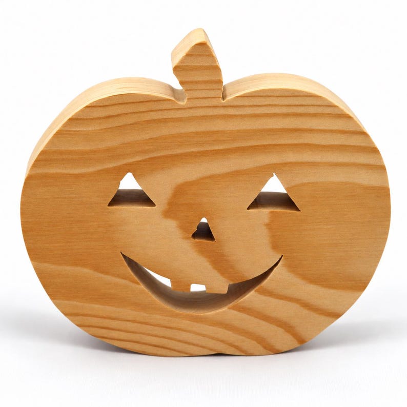 Handmade unpainted wooden Jack-o-Lantern cutout with carved triangular eyes, nose, smiling mouth, and stem, shown freestanding on a white background. Ready to paint for Halloween decoration.