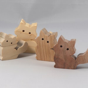 Handmade and unfinished, this stackable toy kitten cat cutout is ready to paint. This unpainted cutout is an excellent option for a fun DIY project or as a pretend toy for children. Available in several sizes, including custom orders.