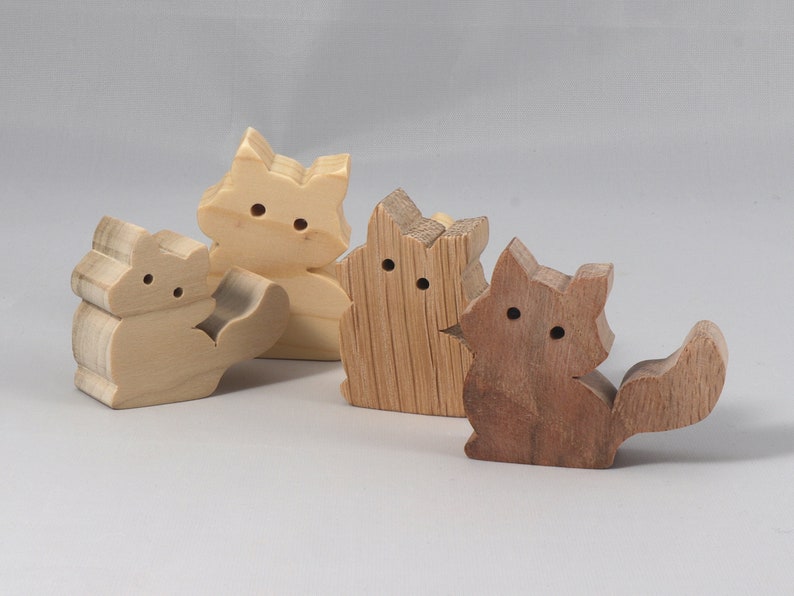 Handmade and unfinished, this stackable toy kitten cat cutout is ready to paint. This unpainted cutout is an excellent option for a fun DIY project or as a pretend toy for children. Available in several sizes, including custom orders.