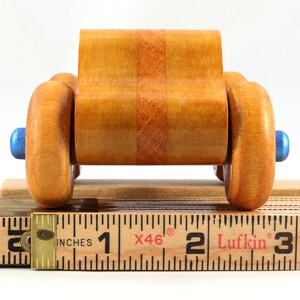 Wood Toy Monster Truck Handmade Form Hardwood and Finished With Amber Shellac With Metallic Saphire Blue Trim.
