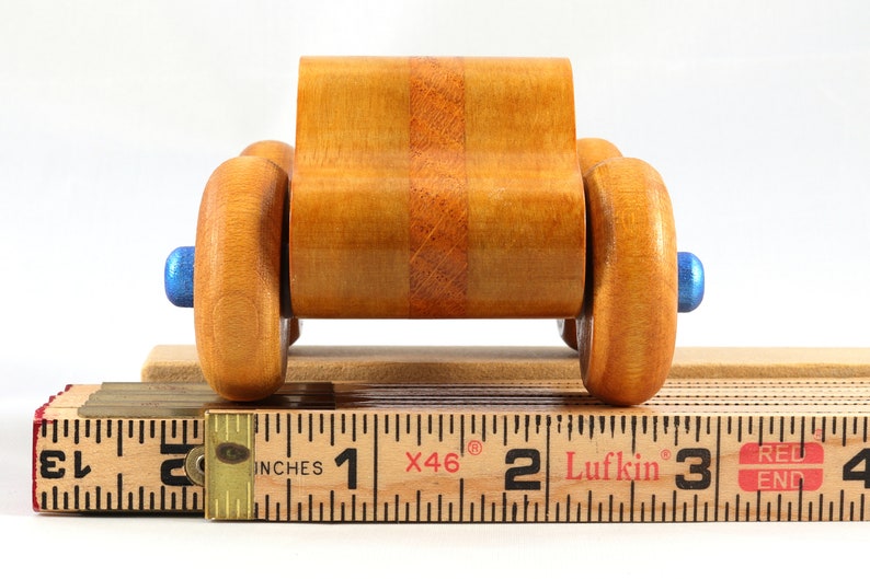 Wood Toy Monster Truck Handmade Form Hardwood and Finished With Amber Shellac With Metallic Saphire Blue Trim.