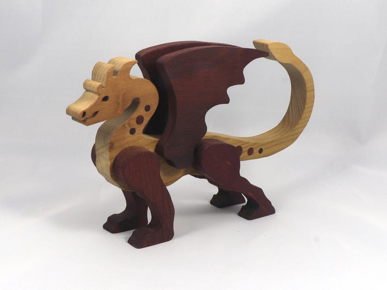 Handmade wood dragon figurine made from select grade contrasting hardwoods and hand-finished with a custom mixture of mineral oil and waxes.