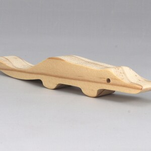 Handmade toy alligator cutout from the Itty Bitty Animal Collection. Crafted with traditional woodworking tools, this unfinished wood alligator is freestanding, smooth-sanded, and ready to paint. Perfect for stacking and imaginative play.