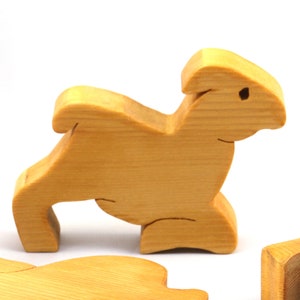 Handmade wooden toy stacking puzzle with five freestanding goats finished with a custom blend of nontoxic oils and waxes.