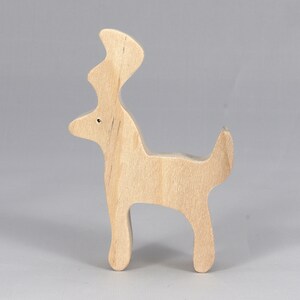 Handmade unfinished wooden deer toy figurine, part of the Itty Bitty Animal Collection, shown in natural light wood with visible grain, standing on a white background.