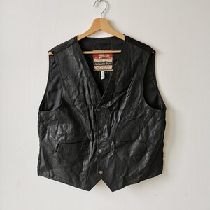 May include: A rustic wooden sign with the text "Welcome to our home" in a handwritten style. The sign has a distressed finish and a simple, inviting design, ideal for entryway decor.