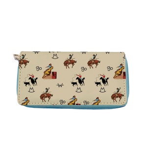 May include: A beige zippered wallet with a repeating pattern of cowboys riding horses and the letters "W" and "M" in a circle. The zipper is light blue.