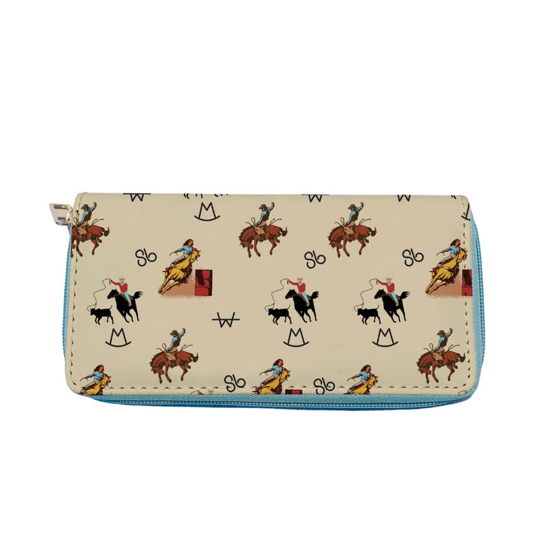 May include: A beige zippered wallet with a repeating pattern of cowboys riding horses and the letters "W" and "M" in a circle. The zipper is light blue.