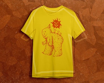 May include: A yellow t-shirt with a red cartoon illustration of a smiling creature with a party hat and a sun with a smiley face above it.