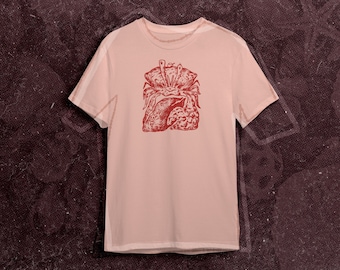 May include: A pink t-shirt with a red graphic print of a crab holding a heart.