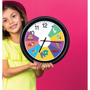 May include: A round wall clock with a black frame and a white face divided into colorful segments. Each segment features a simple icon representing daily activities, including a school bus, bed, shoe, clothing, pet bowl, comb, toothbrush, and toilet.