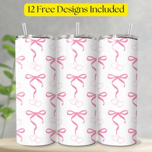 May include: Three white insulated tumblers with pink ribbon and heart patterns. Each tumbler has a silver lid and a clear straw. The text "12 Free Designs Included" is in a yellow rectangle at the top.