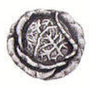 May include: A silver-toned coin with a stylized design of a tree with leaves. The coin has a rough, textured surface.