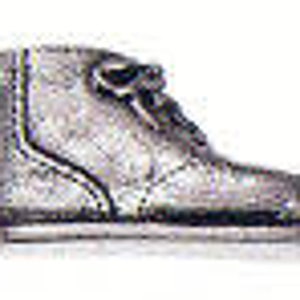 May include: A silver-colored boot charm in the shape of a work boot. The charm has a lace-up design and a rounded toe.