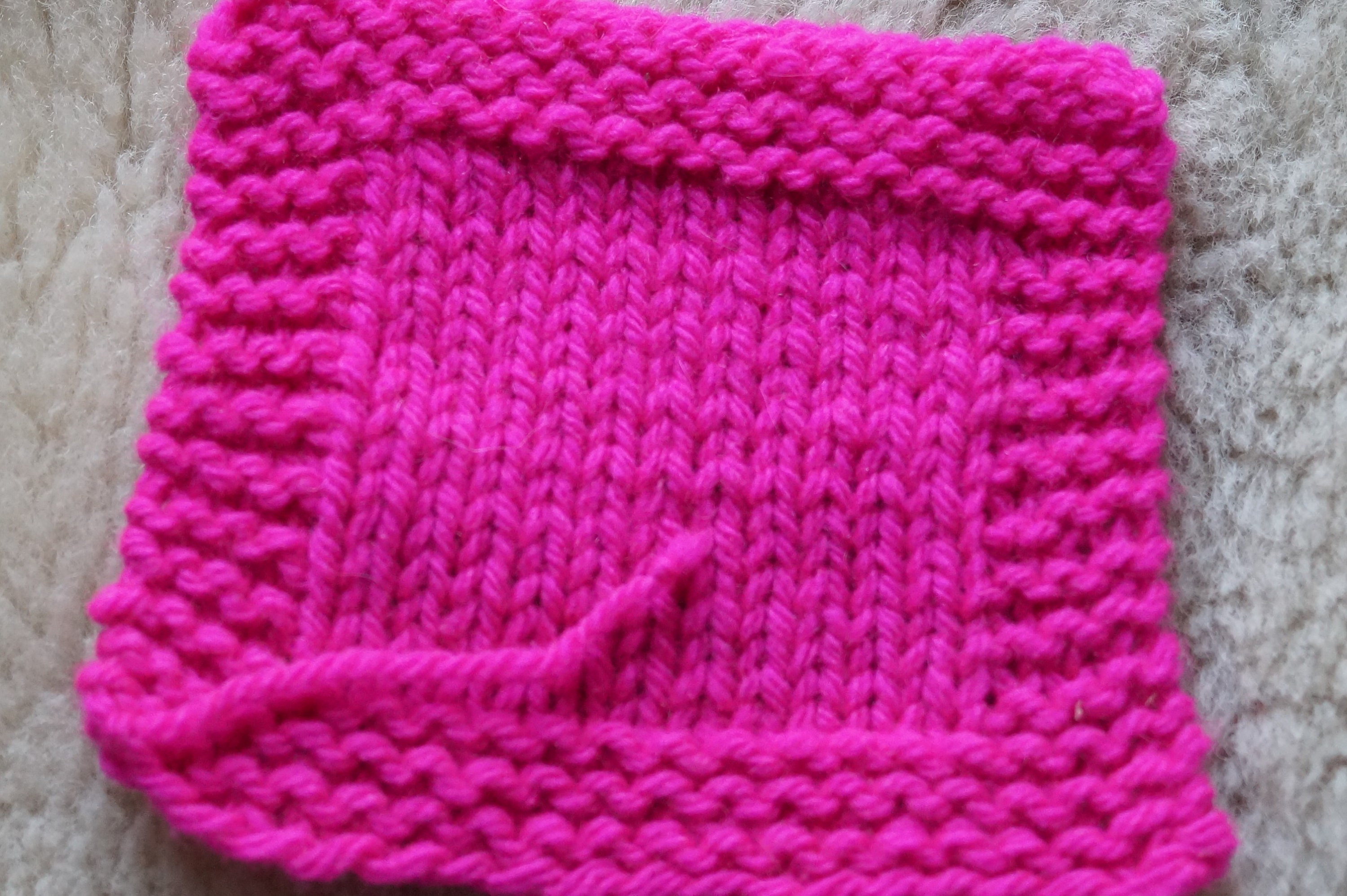 Neon Pink worsted wool hand dyed 3 ply soft wool yarn from our