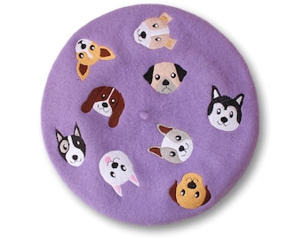 May include: Purple beret with embroidered dog faces. The dogs are all different breeds and have different expressions.