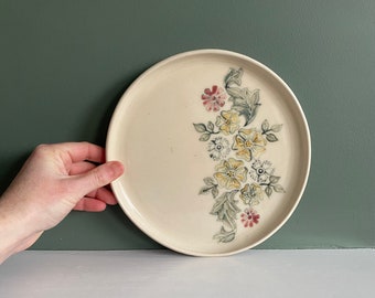 Floral design round plate with flowers illustration on one half of the plate, wheel thrown, hand painted dish