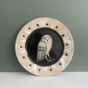 Owl small Stoneware plate with Bird Illustrated round with black background colour and bird line illustration.