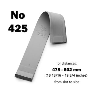 May include: A gray, curved product labeled "No 425" with the brand name "fayas". The text indicates it's for distances between 18 13/16 and 19 3/4 inches. The product has a textured surface and a rectangular shape.