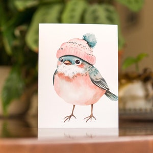 Jolie carte de voeux oiseau d'hiver, oiseau chanteur portant un bonnet rose, jeu de cartes de vœux fait main unique, cadeau pour amoureux des oiseaux, papeterie festive d'hiver