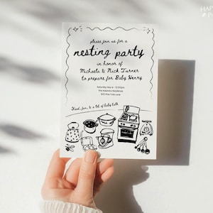 May include: Black and white illustration of kitchen items on a white background. The illustration includes a stove, a kettle, a mixer, a pot, and measuring cups. The text on the invitation reads "Please join us for a nesting party in honor of Michaela & Nick Turner to prepare for Baby Henry. Saturday May 6 - 12:00pm the Adamms Residence 342 Pine Tree Lane Food, fun, & a lot of baby talk."