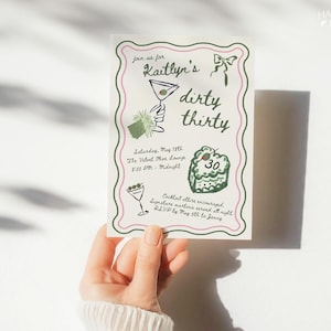 May include: A party invitation with a green and pink border, featuring the text "Kaitlyn's dirty thirty." The invitation includes illustrations of a martini, a cake with the number 30, and event details. The invitation is held by a person.