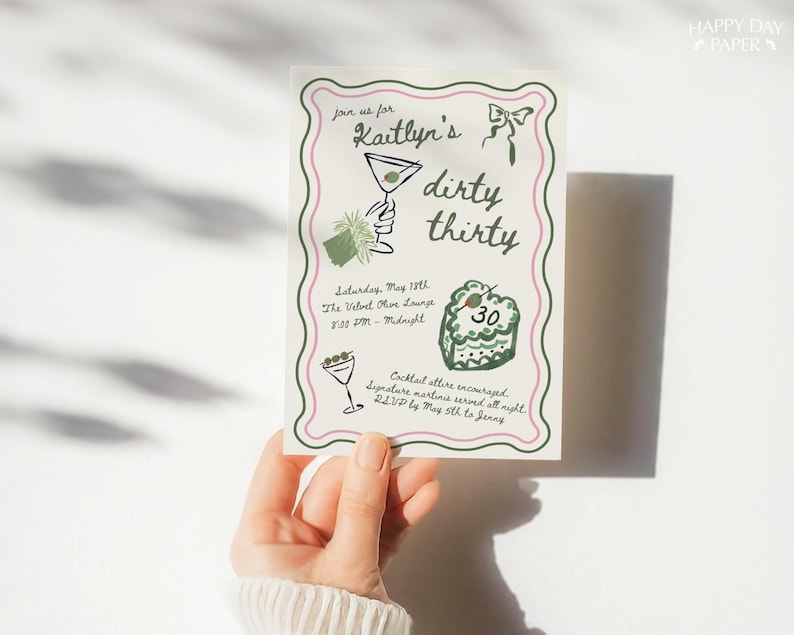 May include: A party invitation with a green and pink border, featuring the text "Kaitlyn's dirty thirty." The invitation includes illustrations of a martini, a cake with the number 30, and event details. The invitation is held by a person.