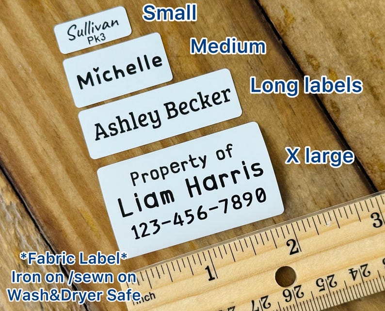 May include: White fabric labels with black text, including names and a phone number. Sizes range from small to extra-large. The text "*Fabric Label* Iron on / sewn on Wash&Dryer Safe.ch" is also visible.