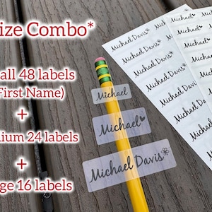 May include: A combo pack of personalized labels with the name "Michael" and "Michael Davis" printed in black script. The pack includes small, medium, and large labels. A yellow pencil is in the image.