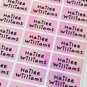 May include: A rustic wooden sign with the text "Welcome to our home" in white lettering. The sign features a distressed finish and a simple, inviting design, perfect for front door decor.