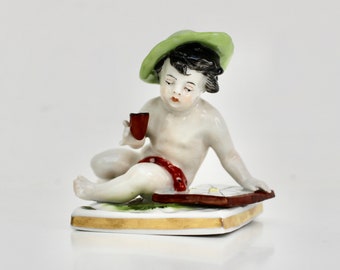 Antique Cherubic Boy figurine, German Porcelain Volkstedt Aelteste.