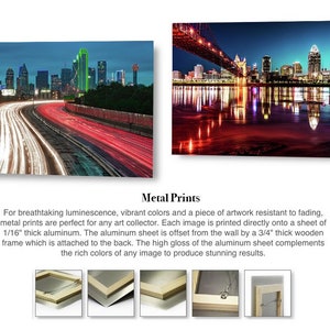 May include: Two metal prints of cityscapes at night. The first print shows a highway with red and white taillights, and the second print shows a city skyline reflected in a body of water.