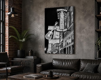 May include: A black and white wall art print featuring a vertical neon sign for Nashville Crossroads and Ernest Tubb Record Shop. The image includes a prominent acoustic guitar graphic and text reading Music City, Real Country Music Lives Here.