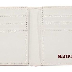 May include: White leather wallet with multiple card slots and a brown "BallPark Leather" logo.