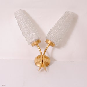 gilded metal wall lights and chiselled glass tulips