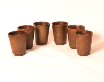 Set of vintage and boho wabi sabi style Digoin stoneware coffee or tea cups