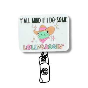 A sticker with a cartoon frog wearing a cowboy hat and a pink scarf, along with the text "Y'ALL MIND IF I DO SOME Lollygaggin'".