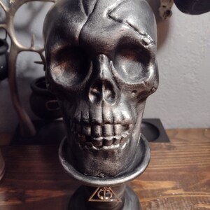 Hallows inspired skull on base