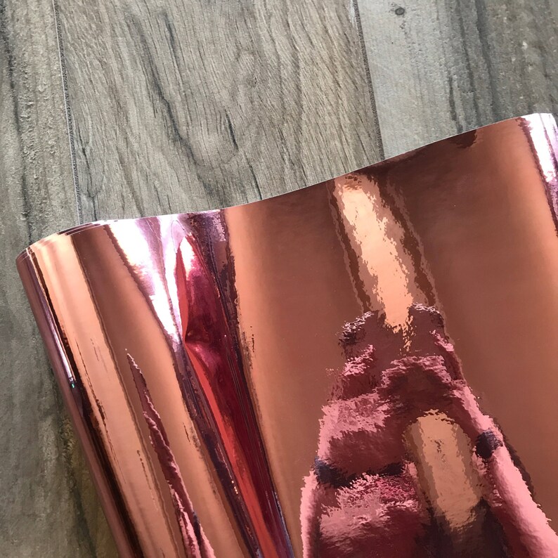 Rose gold chrome mirror vinyl sheets displaying reflective metallic finish
